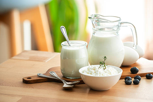 Low-fat dairy and a glass of water on a kitchen table