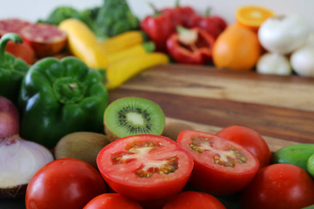 Red capsicum, tomatoes, and orange vegetables