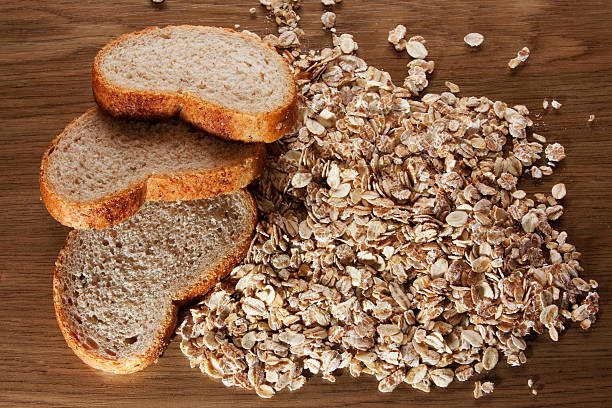 Wholemeal bread and bowl of porridge oats